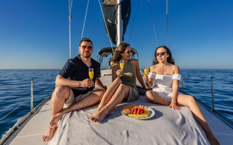 Happy guests on sailboat